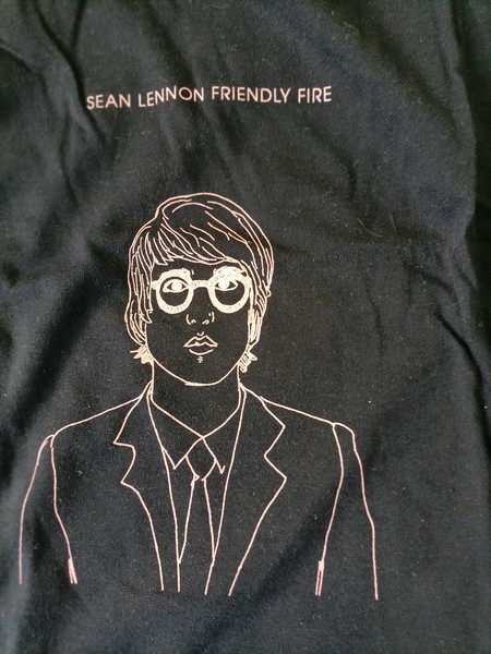 T-Shirt Black  with a self portrait drawing by Sean Ono Lennon  Friendly Fire