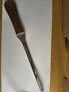 Vintage HMSO letter opener steel with wooden handle.