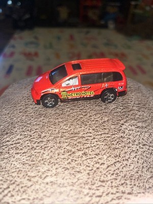 Hot Wheels 1997 Dodge Caravan Metro Hotel Shuttle Orange 1:64 Diecast