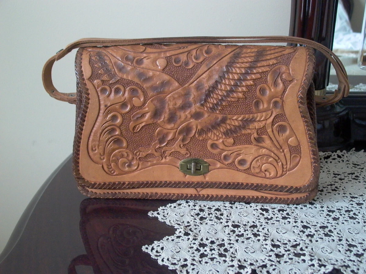 Leather coin-pocket wallet with all-over embossed eagle