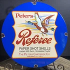 VINTAGE PETERS REFEREE PAPER SHOT SHELLS 12” PORCELAIN SIGN AMMO CARTRIDGES