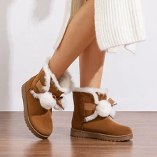 Women's  Fur-Lined Suede Boots with Pom-Pom Accents Combining Warmth Style