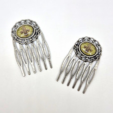 pair of vintage metal hair side combs featuring a fleur-de-lis design