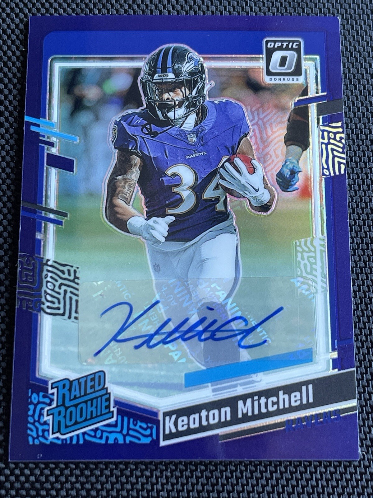 2023 Donruss Optic Rated Rookie Purple Auto #207 Keaton Mitchell /35 Color Match