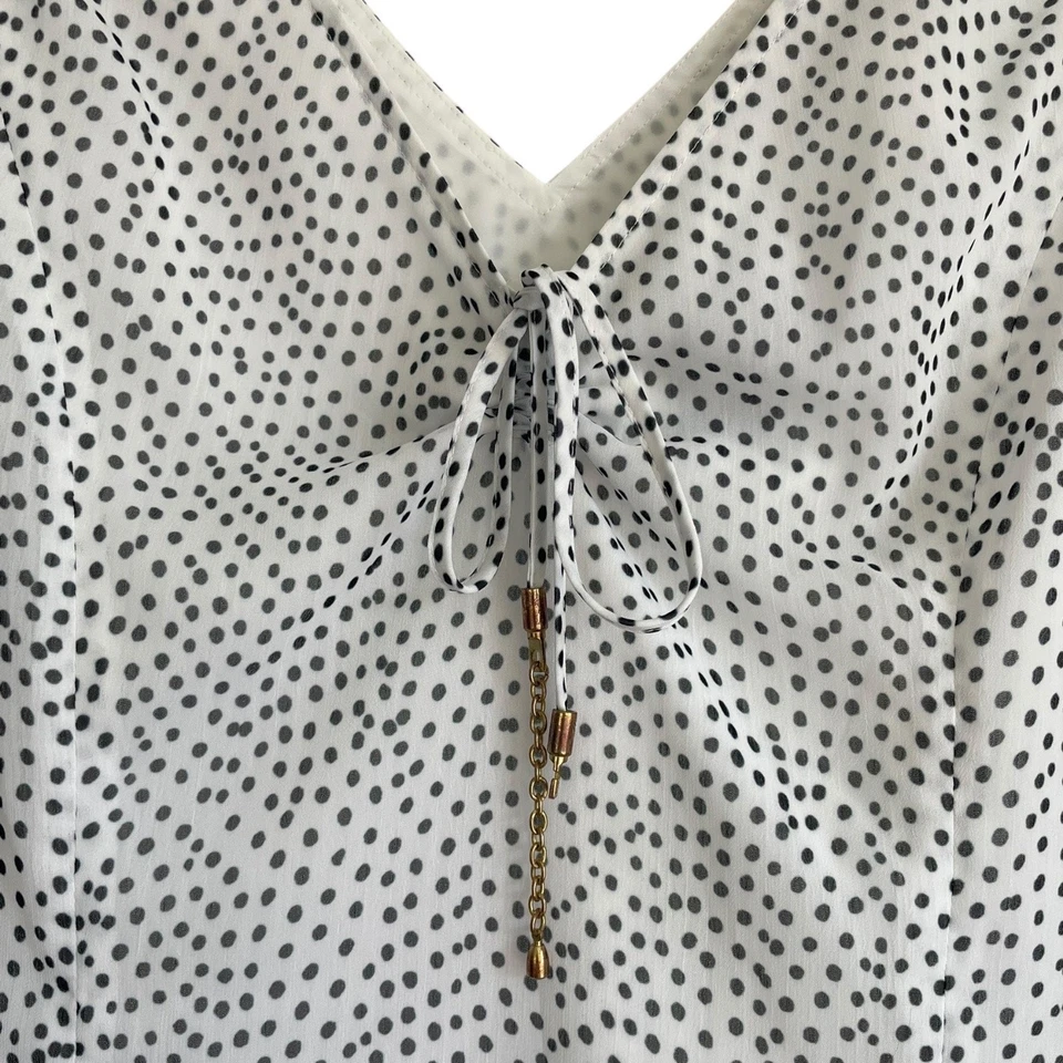 Blusa sin mangas Doncaster blanca y negra a lunares transparente con cuello en V Foto 3 de 4