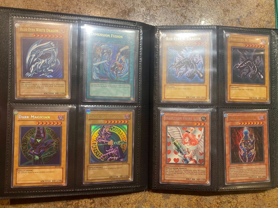 YUGIOH binder collection VINTAGE. blue eyes white dragon, 1st ed flame