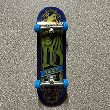 Tech Deck Mini Skateboard featuring Nick Tucker and a unique wolf design.