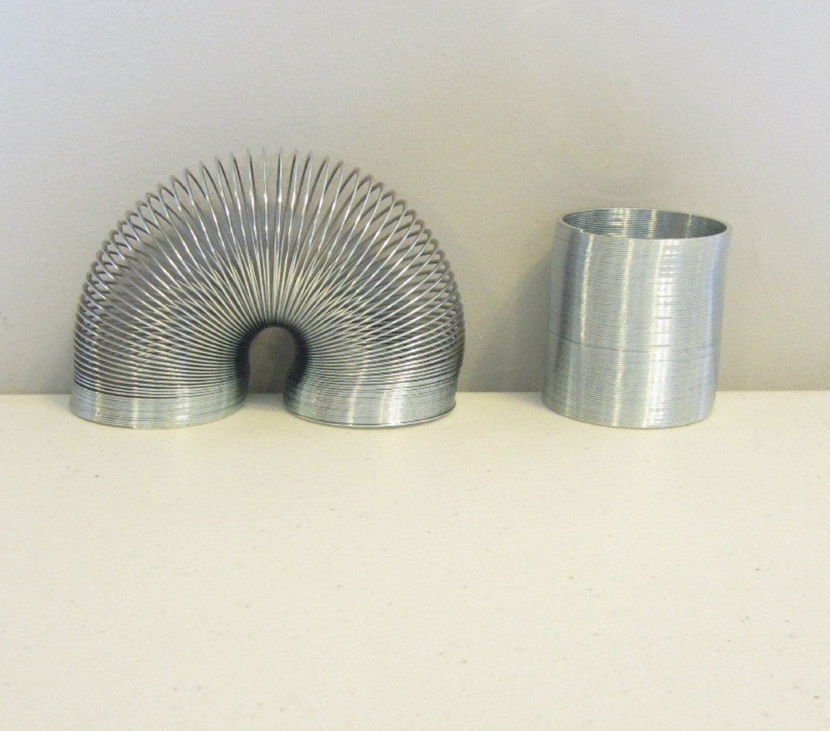 NEW SILVER METAL COIL SPRING CLASSIC KIDS TOY PARTY FAVOR