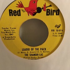 THE SHANGRI - LAS 7" VINYL SINGLE , LEADER OF THE PACK / WHAT IS LOVE THE SHANGRI - LAS 7" VINYL SINGLE , LEADER OF THE PACK / WHAT IS LOVE