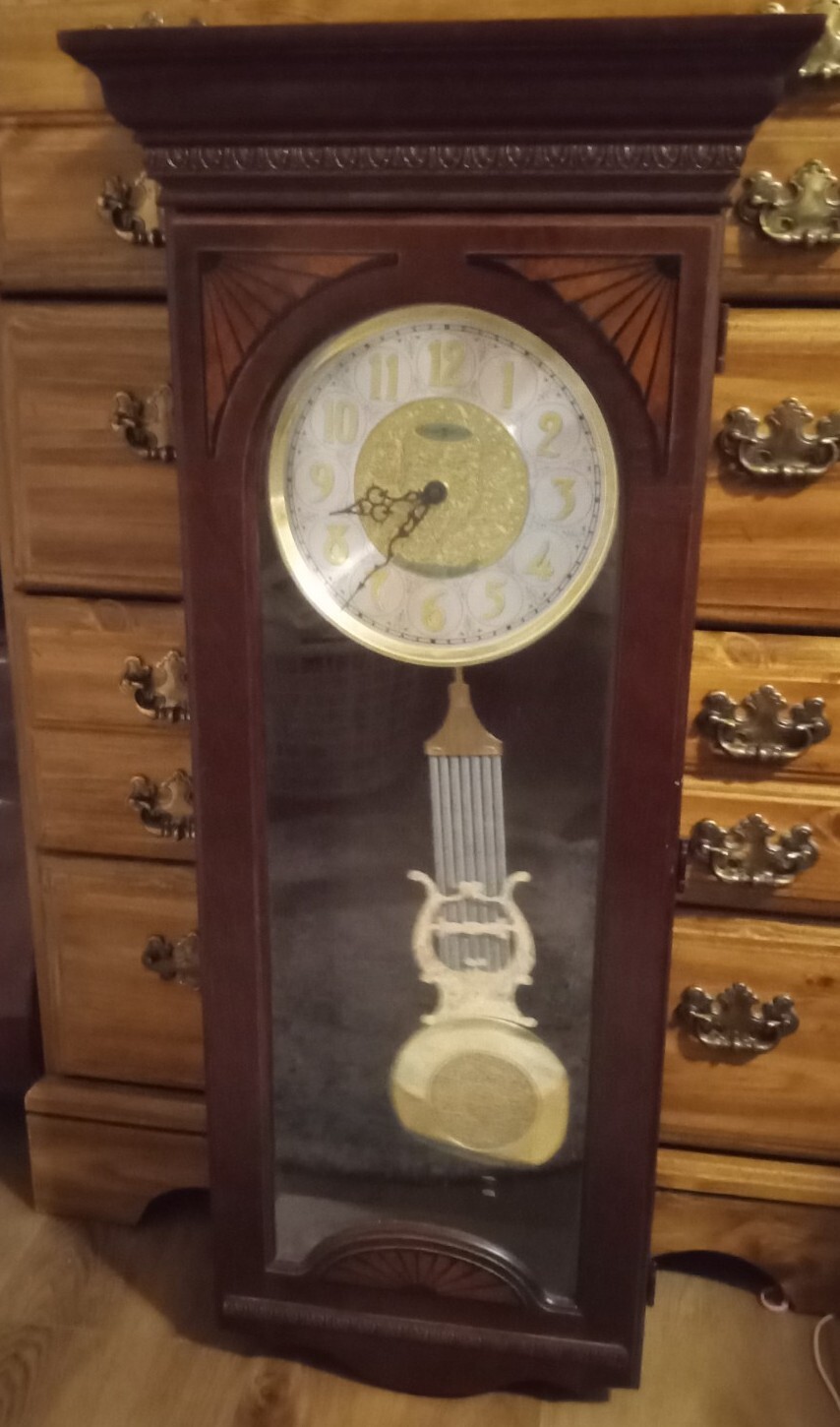 Beautiful Retired Howard Miller electric wood wall clock chime pendulum
