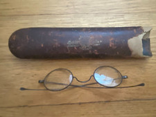 Antique leather eyeglass case and Ben Franklin style spectacles