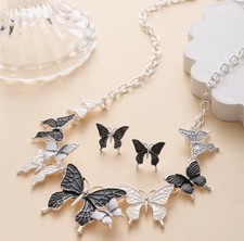 Pierced silver and gray butterfly necklace and earring set