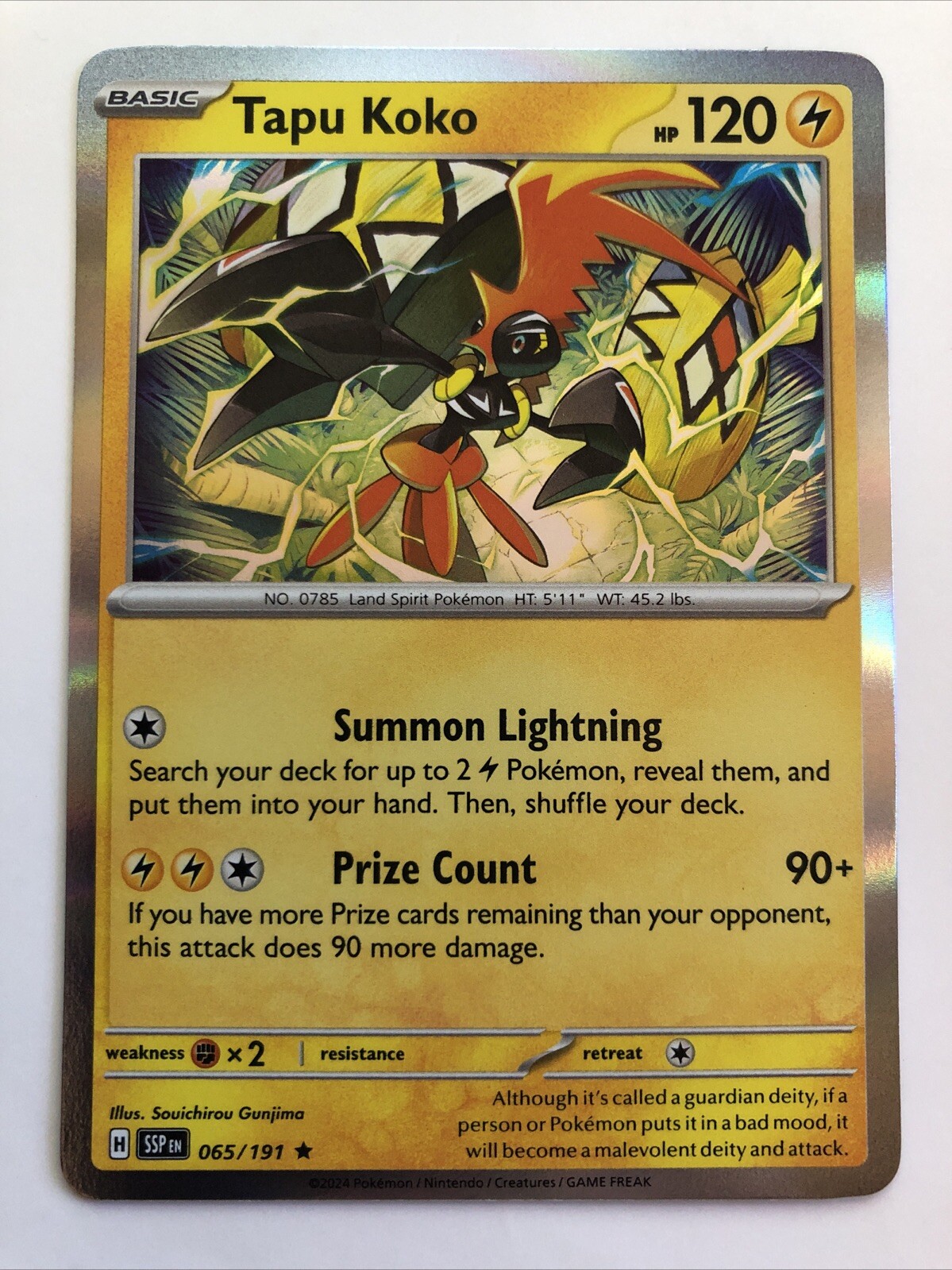 Pokémon TCG Surging Sparks Tapu Koko Holofoil 065/191 NM Rare