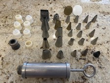 Vintage Aluminum Cake Decorator Set With Many Tips And Two Flower Stands