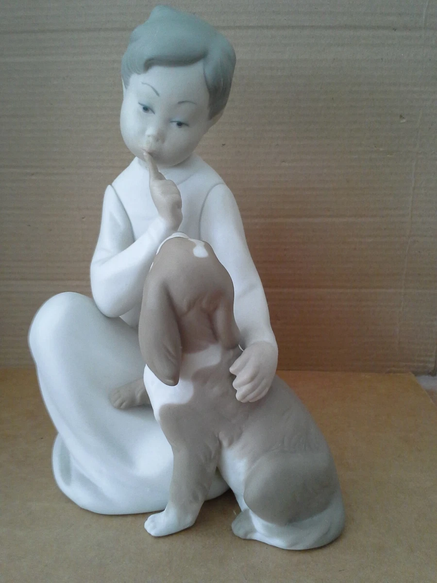 Lladro boy sitting with cheap dog