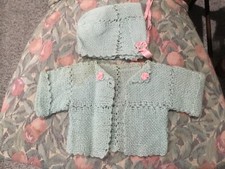 Hand knit baby sweater with hat