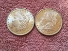 MORGAN SILVER DOLLAR COINS.  LOT OF 2  1884-0  AU. / UNC.   LOT # 17