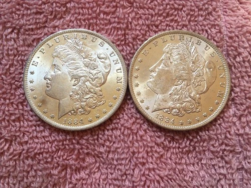 MORGAN SILVER DOLLAR COINS.  LOT OF 2  1884-0  AU. / UNC.   LOT # 17