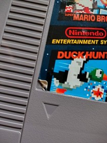 Juego de acci&oacute;n NES en caja sistema de entretenimiento Nintendo con Zapper y Super Mario Bros