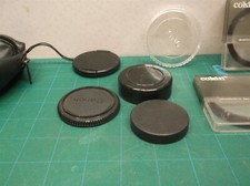 lot of camera lenses caps filters