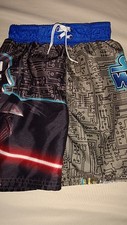 Star Wars boys sz. XS character design swim trunks. Great pair.