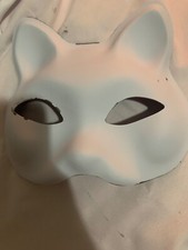 plastic cat mask. White. Has some gray spots that were there when first shipped.