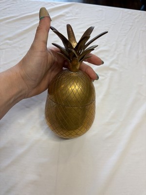 A Vintage and Antique brass pineapple-shaped box also a candlestick.