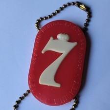 Seagram's Red and White Plastic souvenir key chain with Distillery Theme.