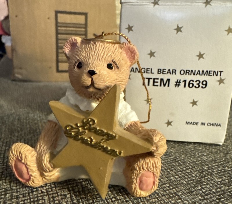 Angel Bear Ornament Item # 1639 holds a star with Merry Christmas on the star