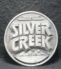 WI15162 VINTAGE 1982  SILVER CREEK  WESTERN CUT SMOKELESS TOBACCO BELT BEUCKLE