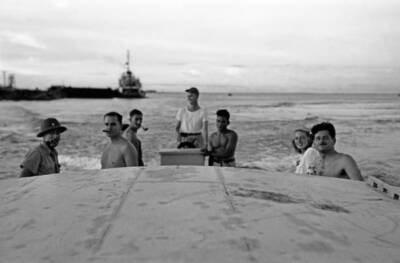Radio writer and host Norman Corwin is photographed fishing off 1940s Old Photo