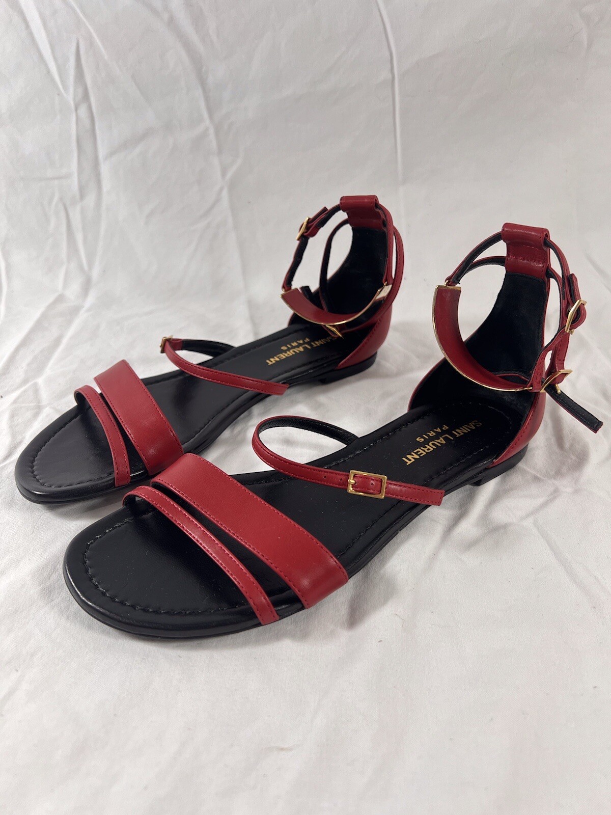 Sandali piatti Saint Laurent in pelle rossa Janis cinturino alla caviglia gladiatore 35 5 5 5 US