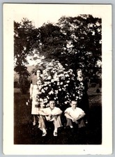 Vtg B&W Snapshot Group In Garden Poses With Flowers 1940s