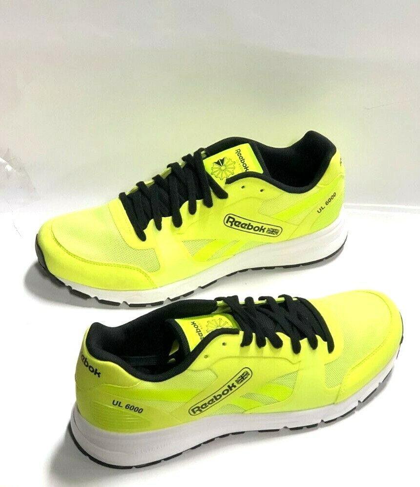 black and yellow reebok classics