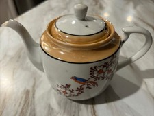 Vintage Japanese hand-painted lusterware teapot with floral and bird motifs.