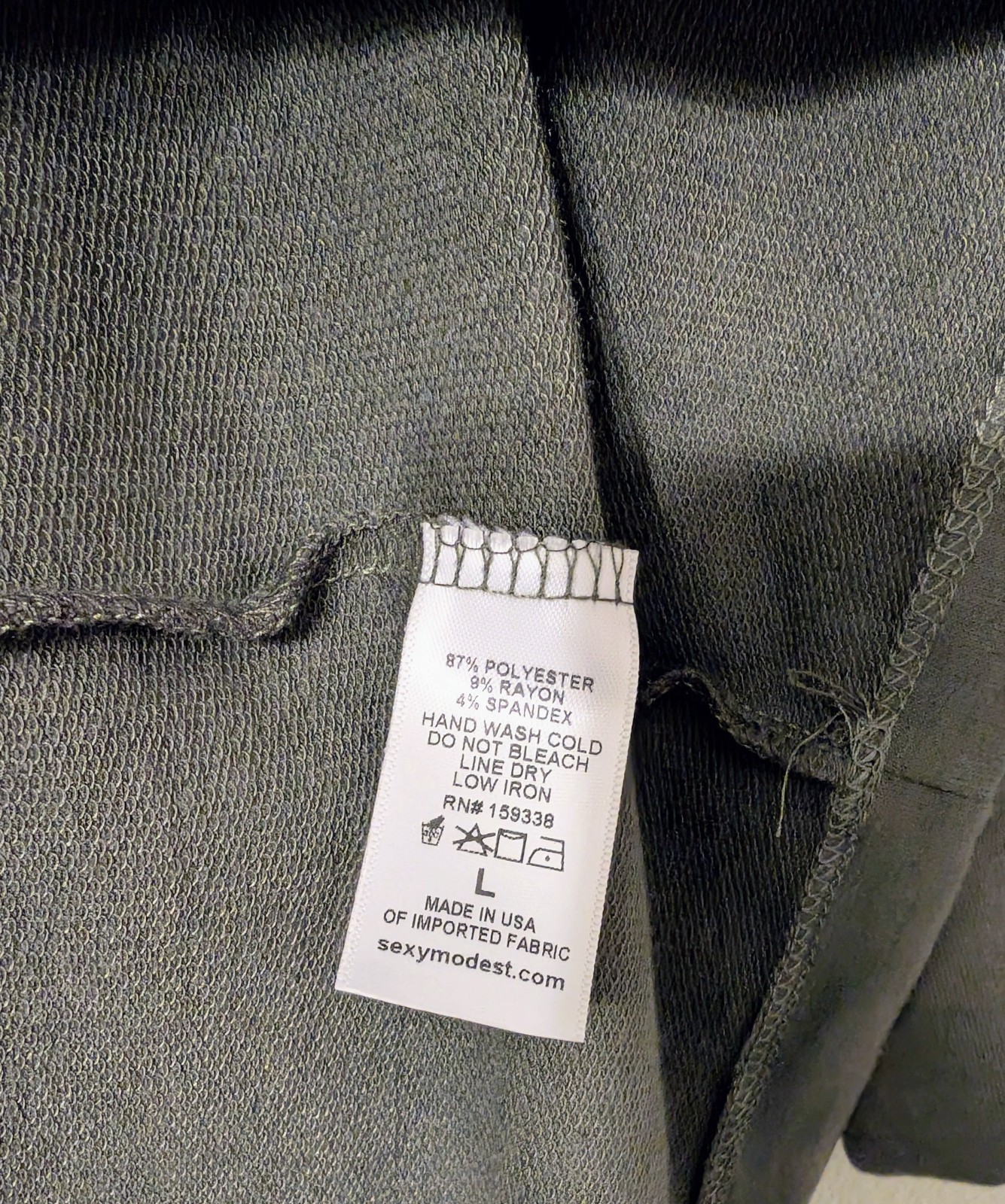 White Brigitte Brianna Essential Dress Olive women's comfort activewear tag with fabric details and USA made label.