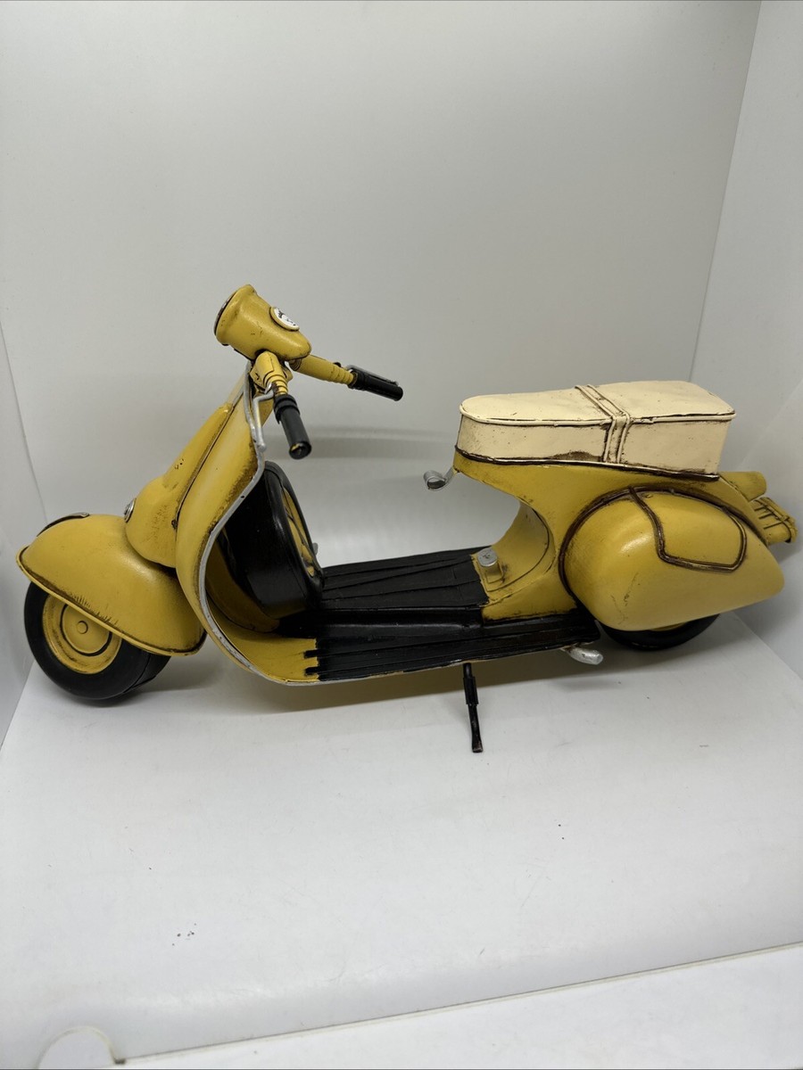 Tin Metal Art Sculpture of a Yellow Vespa Motor Scooter Stationary