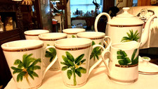 ceramic tea set with 6 mugs 1 creamer and 1 teapot marked