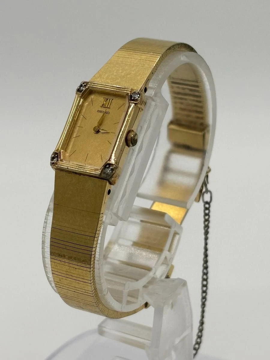 Reloj de cuarzo para dama Seiko 2E20-5520 esfera dorada 4 piedras correa genuina de Japón
