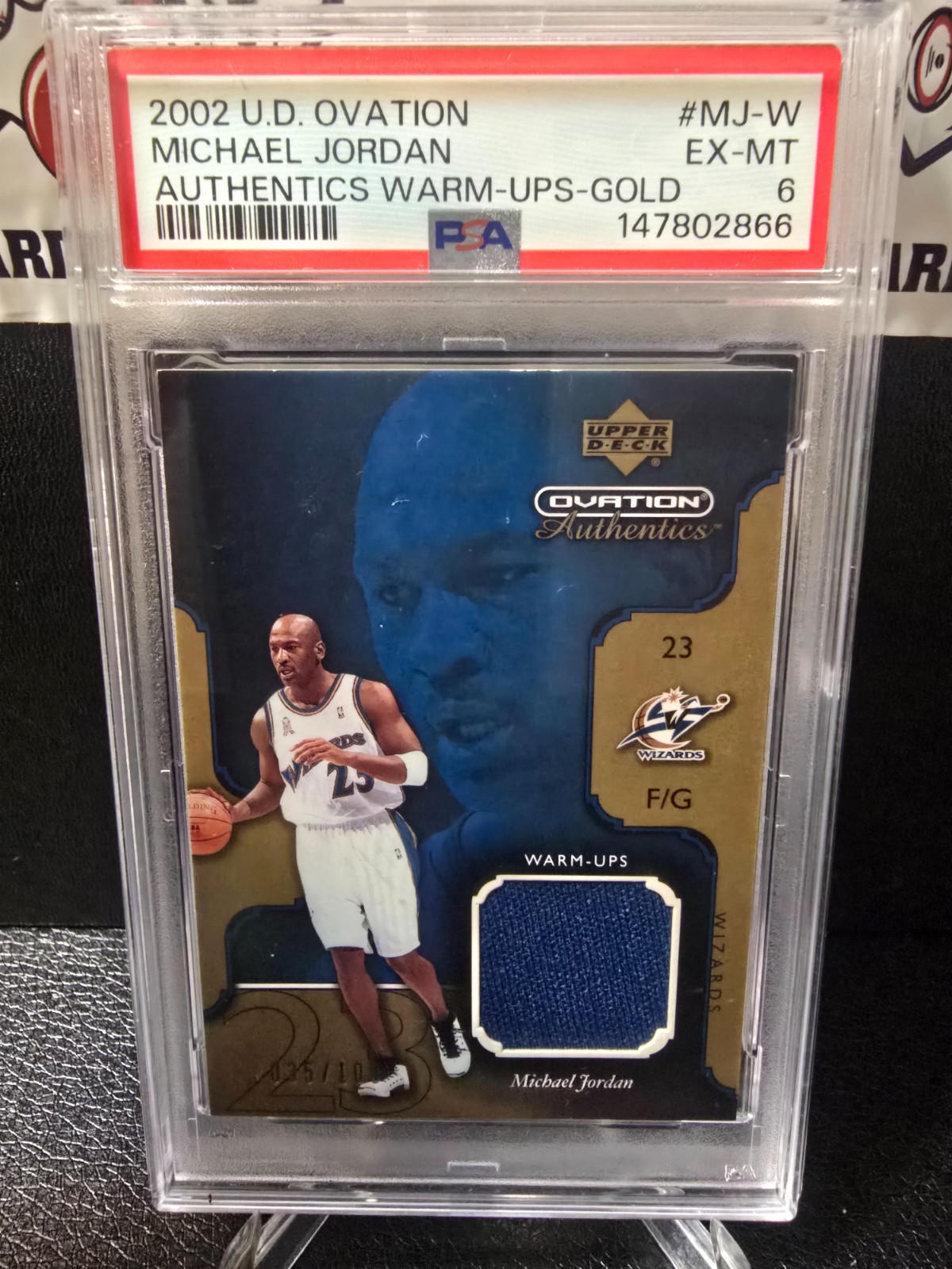 Michael Jordan #MJ-W Basketball Cards 2002 Upper Deck Ovation Authentics Warm-Ups trading card — raw and PSA graded price guide