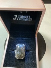 sterling silver ring features a rectangular dendritic agate stone, often referre