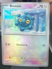 Pokemon TCG SV Prismatic Evolutions Bronzor 066/131 Master Ball Reverse Holo NM