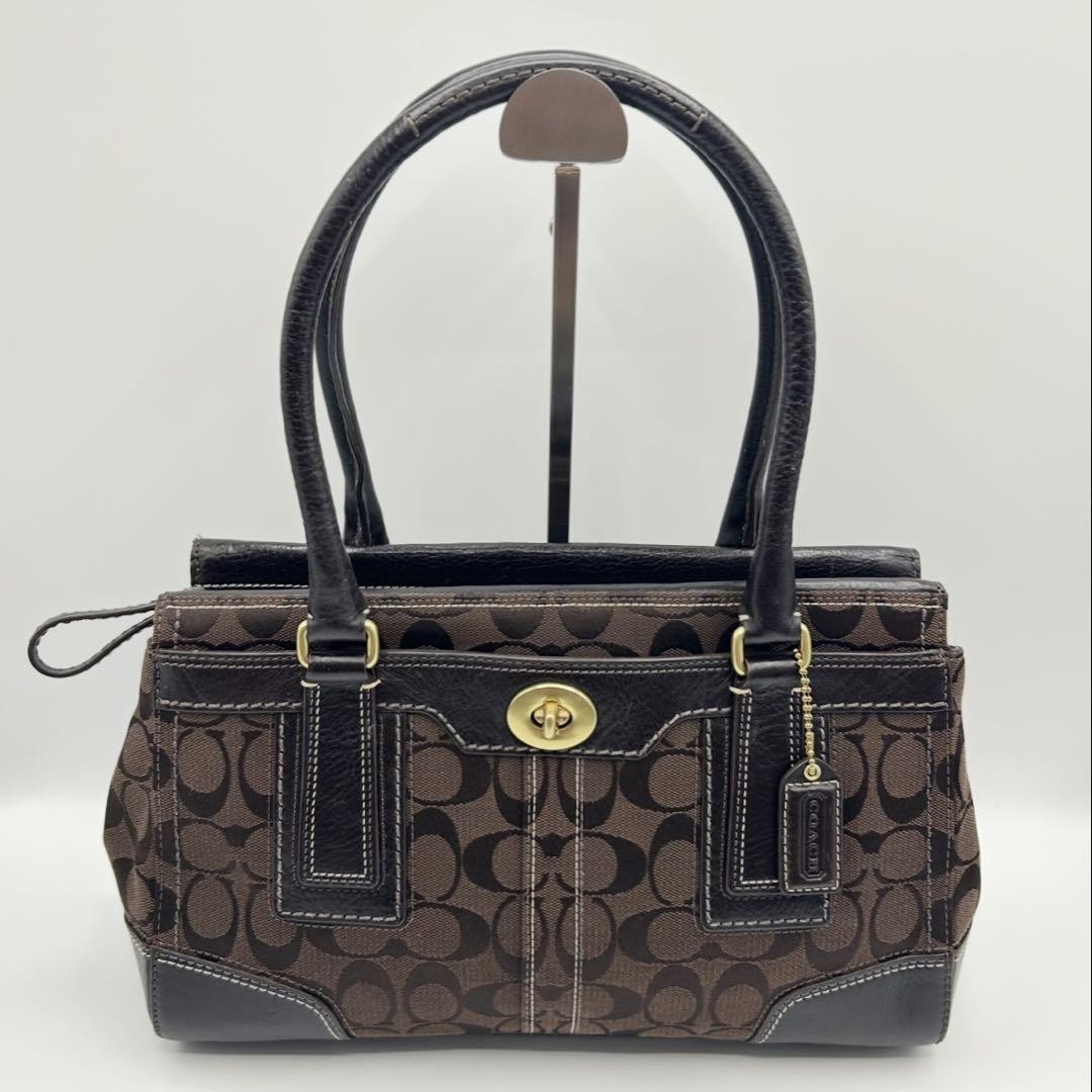 COACH Signature Canvas Top Handle Bag with Turn-Lock Closure