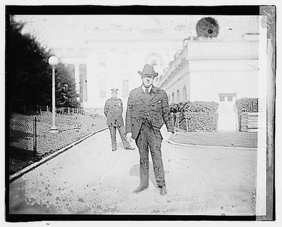 Photo:Seymour Stedman 1920 Man in Suit Hat Building Exterior