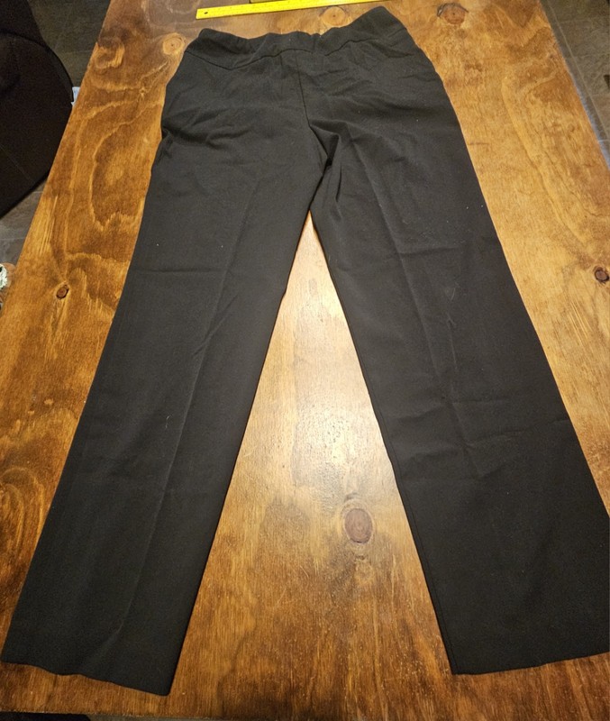 C3, The product is a pair of black dress pants for women by the brand Investment
