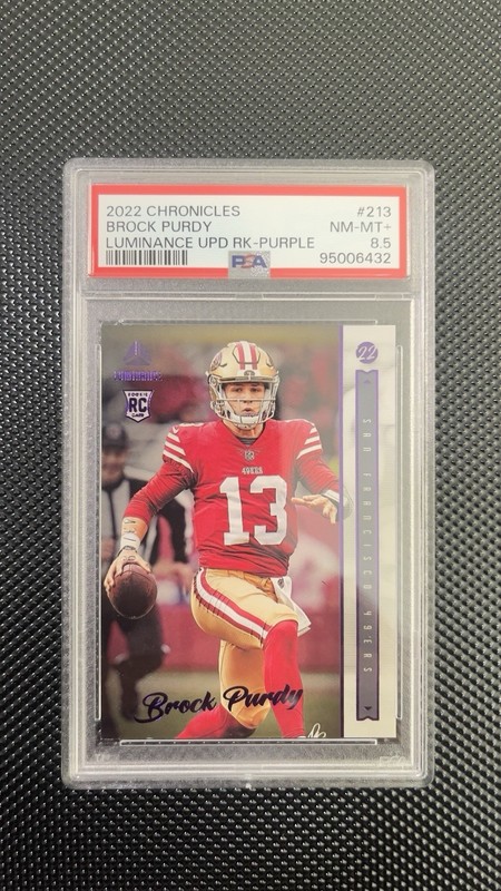 2022 Panini Chronicles - Luminance Update Rookies Brock Purdy #213 Purple PSA8.5