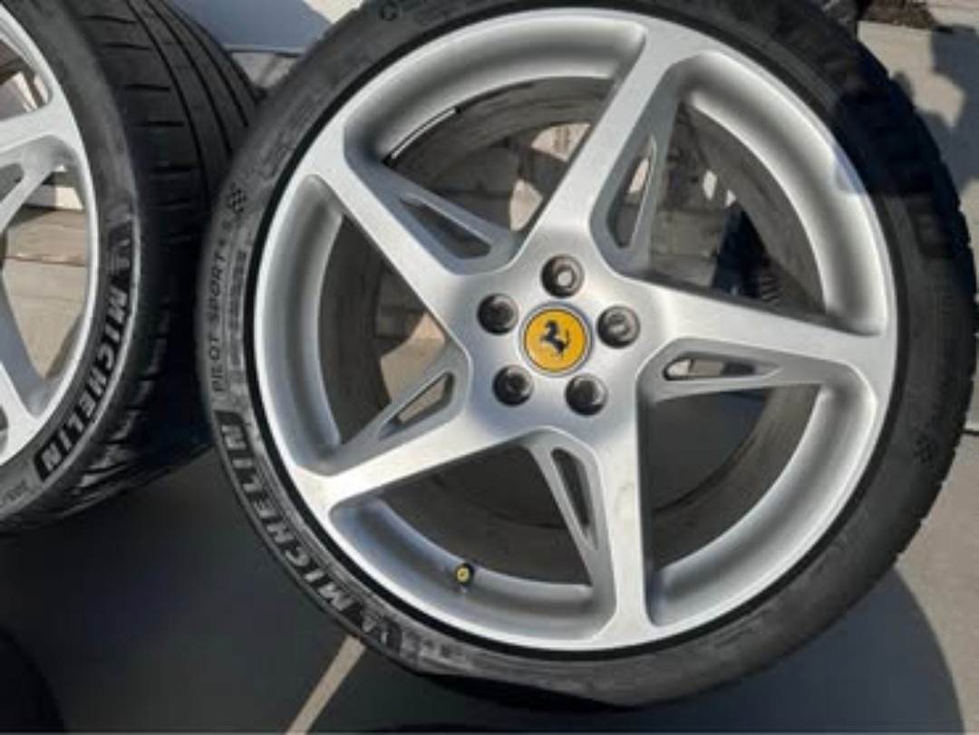 Here is a full set of ferrari original Wheels off of a 458 italia. 