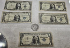 Silver Certificates and a Morgan Silver Dollar - all are well circulated
