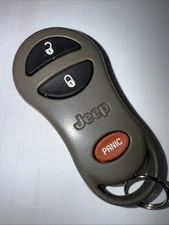 OEM 99-04 JEEP KEY LESS REMOTE ENTRY FOB TRANSMITTER CLICKER 56036859 GQ43VT9T