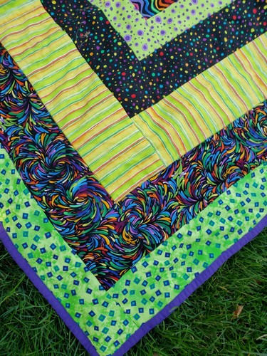 reversible lap quilt baby blanket neon prints solid color on back 37"x48" - Picture 2 of 4